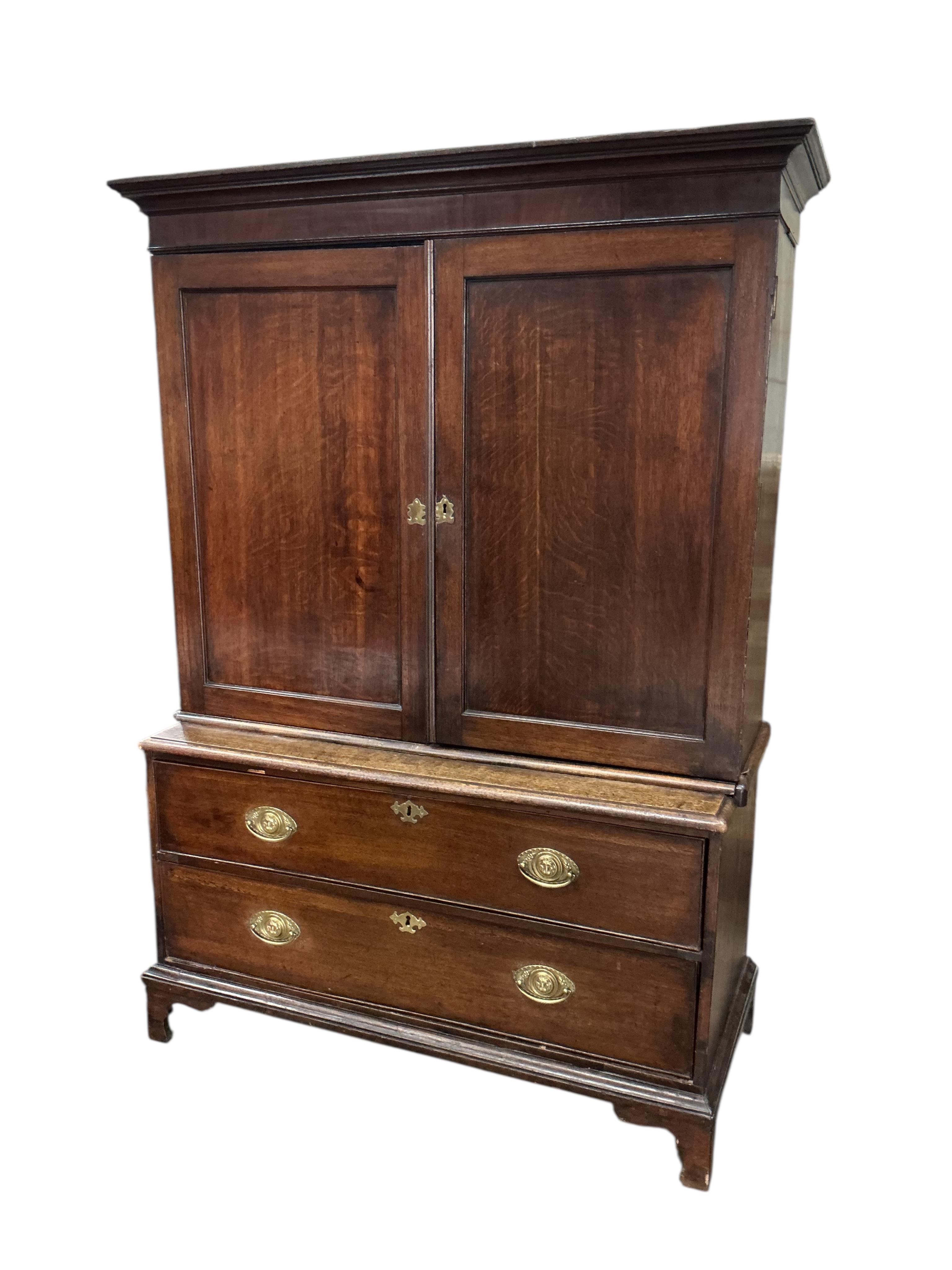 A George III oak mahogany cabinet on chest, adapted, width 115cm, depth 53cm, height 171cm